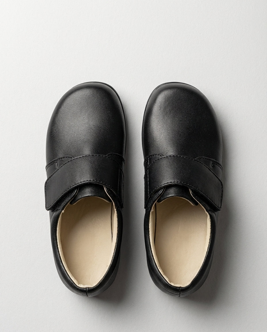 Boys black everyday leather shoe — three-quarter angle