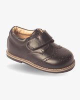 Boys classic black strap wingtip shoe — front view