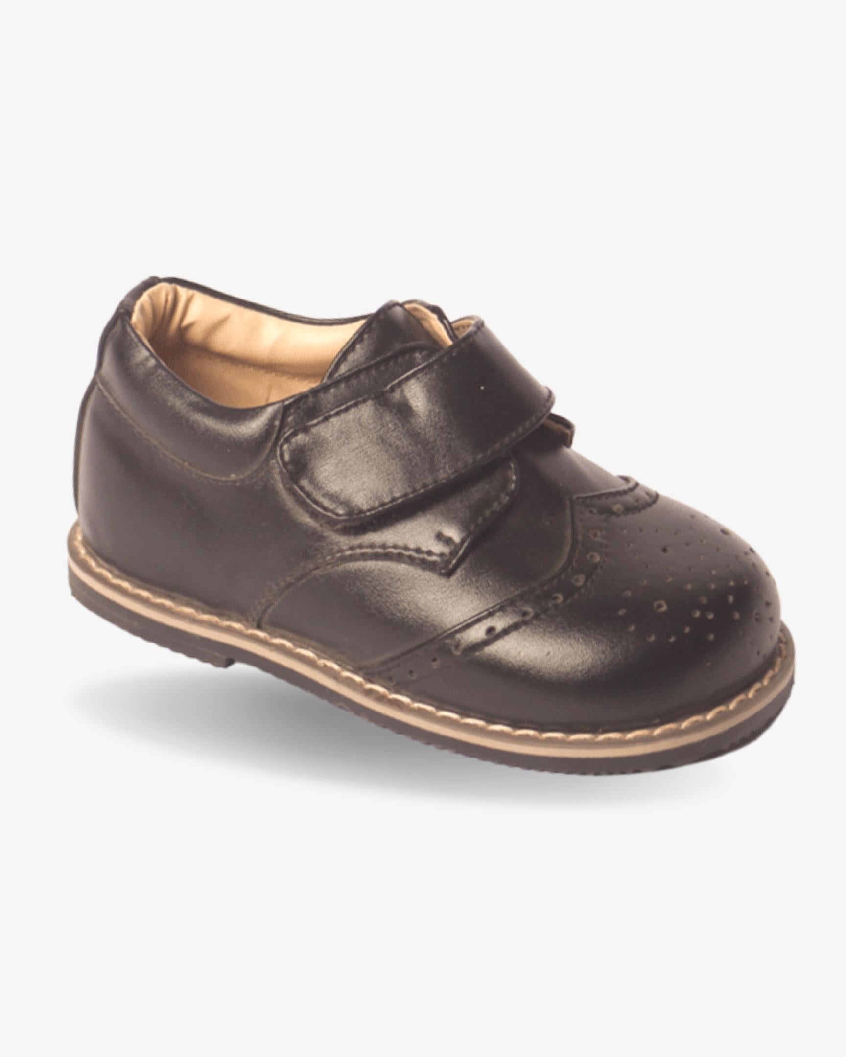 Boys classic black strap wingtip shoe — front view